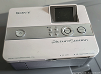 Top front view of Sony PictureStation digital photo printer model DPP-FP55, showing LCD screen and control buttons across the top