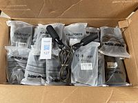 Opened box showing multiple individually packaged YZLSPORTS skipping ropes plus two unbagged skipping ropes on top.