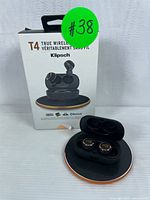 Photo showing Klipsch T4 earbuds in charging case and product box labeled with item number.