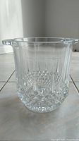 Full view of the clear crystal glass ice bucket, medium size, with built-in handles and diamond pattern design on sides.