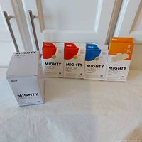 All 7 boxes arranged in a line showing distinct packaging and quantities of patches