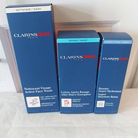 Overview of the three boxed Clarins Men skincare products showing front side with product names and volumes.