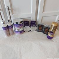 Photo of the entire lot arranged on a white surface showing The Mane Choice products, Shea Moisture soap bars, and Pantene bottle