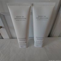 Two tubes of Elizabeth Arden White Tea Skin Solutions Gentle Purifying Cleanser side by side showing front labeling and size.