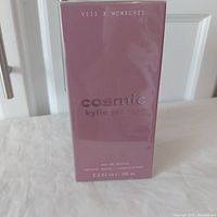 Front view of the mauve box with 'cosmic kylie jenner' text, 100 ml size noted at bottom.