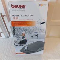 Front of box showing the product brand, model, and key features with an outdoor winter image.