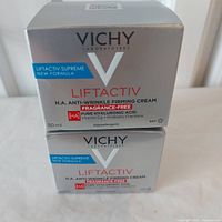 Two stacked sealed boxes of Vichy Liftactiv H.A. Anti-Wrinkle Firming Cream 50 ml each, showing front packaging with product information and branding.