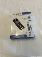 Front of the boxed TIK KEY Universal Bluetooth key finder showing image of device and brand name.