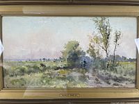 Front view of framed landscape painting featuring fields, trees, cattle and a figure, signed Reginald Jones.