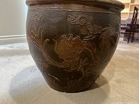 Front view of planter showing relief dragon motif