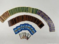 Photo showing arranged Magic: The Gathering cards, Yu-Gi-Oh cards, Digimon cards, and Harry Potter cards.