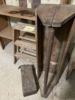 Overall view showing large toolbox, small wooden box, and 2-step ladder in basement setting