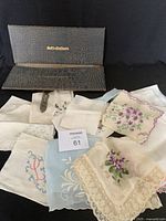 Group of vintage handkerchiefs displayed with snake skin look holder open showing 'Soft-collars' text
