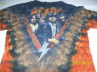Front view of AC/DC T-shirt with detailed view of band members' graphic print, logo, and tie-dye background.