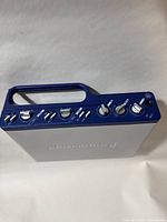 Front and top view of the Digidesign MBox audio interface showing control knobs and handle.