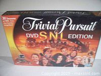 Box packaging showing the Trivial Pursuit DVD SNL Edition with cast photos and 30 seasons trivia mention.