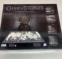 Front view of the Game of Thrones Puzzle of Westeros box showing brand new sealed puzzle packaging with images of the puzzle and key locations.
