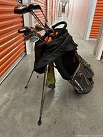 Full view of Cobra stand bag loaded with clubs in storage unit