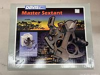 Box with graphic image of Davis Master Sextant and information about included case.