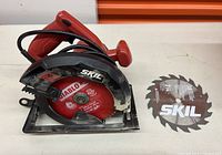 Photo shows Skil circular saw with installed Diablo blade and separate Skil blade alongside.
