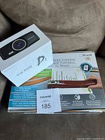 Photo showing boxed AUTOVOX Car DVR dash camera and boxed Pandigital handheld wand scanner.