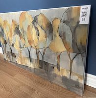 Side angle view of the watercolor trees canvas showing the depth and colors