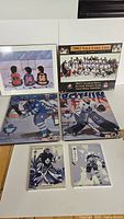 Grouping of 6 hockey wooden poster plaques arranged on table