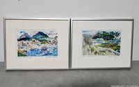 Two framed watercolor prints by Susan Wood side by side, viewed from the front showing full artworks and frames.