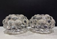 Front view of two clear ORREFORS crystal candle holders showing bubble geometric pattern.