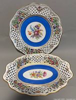Top view of both Dresden reticulated shallow bowls showing detailed lattice work, floral designs, and gold trim.