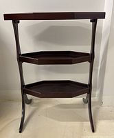 Front view of the 3-tier accent side table showing the overall structure and design.