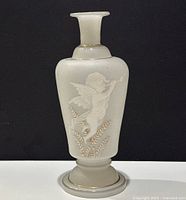 Front angle showing frosted glass vase with cherub and gold leaf designs