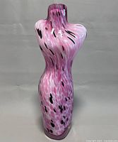 Full view of the purple, white, and black speckled art glass female bust vase approximately 18 inches tall.