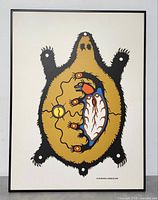 Full view of framed Clemence Wescoupe print showing stylized turtle design in black, gold, red, and blue colors on white background