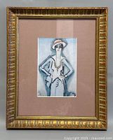 Full front view of framed Coco Chanel print by Kees van Dongen showing gold ornate frame and matting.