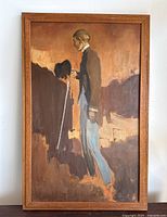 Full front view of framed painting showing subject standing with cane in side profile against abstract brown background.
