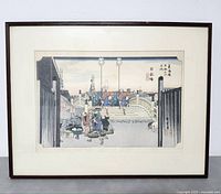 Full view of framed woodblock print showing the entire piece with visible matting and frame.