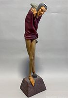 Full view of vintage handmade Mephistopheles sculpture showing figure and base from a slightly angled front perspective with visible details and colors.
