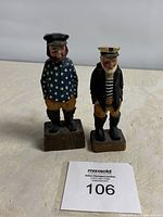 Pair of Atlantic folk art wood carvings, two carved men with maritime attire, standing on wooden bases, one signed 'Alen'