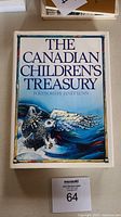 Front cover photo of The Canadian Children's Treasury book showing title, foreword author, and owl illustration.