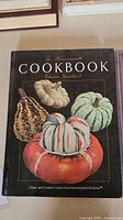 Cover photo of The Harrowsmith Cookbook Volume Number 1 showing gourds and pumpkins on black background
