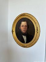 Front view of oval portrait painting in gilt wood frame