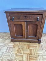 Front view of Louis Philippe buffet cabinet showing drawer and double door.