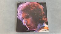 Front cover of Bob Dylan At Budokan double LP album showing Bob Dylan profile photo with minor wear