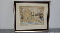 Framed aquatint showing stone building covered in snow and leafless trees