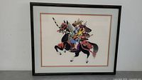 Full view of framed embroidery art showing a Japanese warrior on horseback.