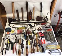 Overhead view of entire lot showing all tools laid on white background