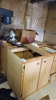 Overall assembled view of three base cabinets showing doors and drawers