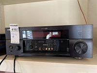 Front view of Yamaha RX-V1800 stereo receiver showing main controls and display.