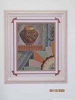 Full view of framed Navajo sand painting showing pottery and geometric rug-inspired designs.